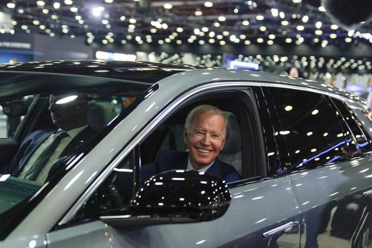 Biden introduces strictest US car emission rules, promotes EVs