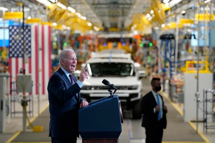 Biden introduces strictest US car emission rules, promotes EVs